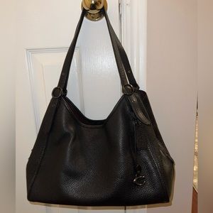 Black COACH shoulder bag in soft pebble leather.